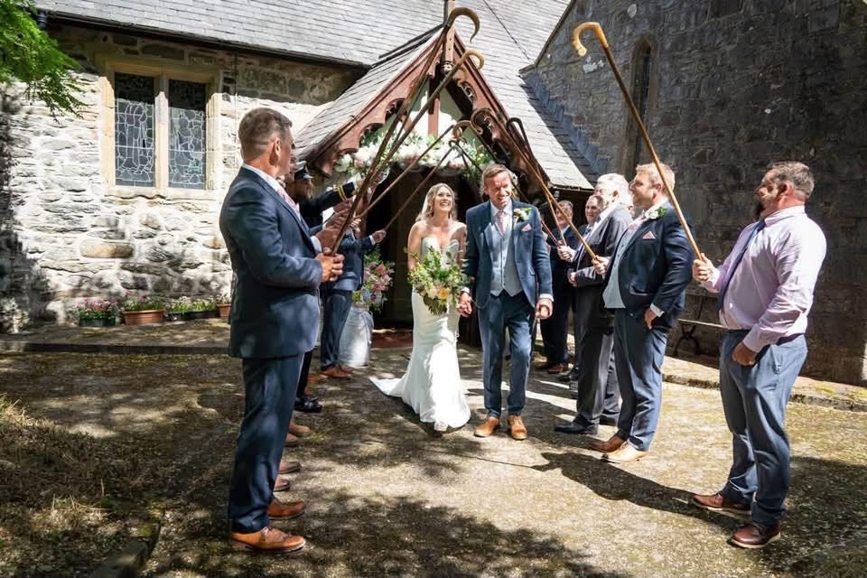 Bridge and Groom exiting the Church with a guard of honour